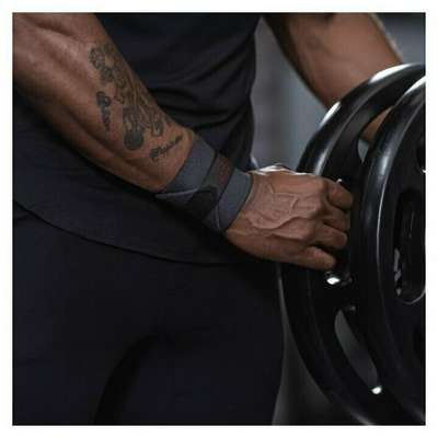 БАНДАЖ ДЛЯ ЗАПЯСТЬЯ БОДИБИЛДИНГ СЕРЫЙ DOMYOS - купить в интернет-магазине